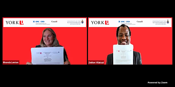 Professor Zeblon Vilakazi from Wits University and Professor Rhonda Lenton from York University signs the MOU.
